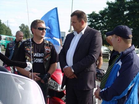 Head of the District Executive Committee Vasiliy Ogievich communicates with bikers